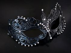 This captivating set includes two stunning masks, both designed in the classic Venetian style. The mask is adorned with sparkling rhinestones, reflecting the light and adding a touch of enchantment to her look while the black mask includes shimmer and exudes strength and sophistication, making him a charismatic presence at any masquerade or other special events.


Age Group/Gender - Adult/Unisex

Size/Type - One size fits all adults

Mask Color - Black
Mask Material - Metal women's, polyresin me Black Masquerade, Couples Masquerade Masks, Female Mask, Masquerade Masks, Venetian Masks, Masks Masquerade, Type One, Black Mask, One Size Fits All