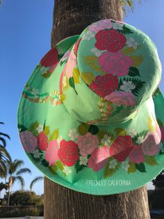 "Super Pretty! Just love the mint green on this tropical print sunhat and the pink flowers look gorgeous against the green. This stunning wide brim sunhat has a large, foldable brim that not only frames your face beautifully when folded up, but protects your face from the sun when the brim is down. I fell in love with this gorgeous fabric while on a weekends getaway, so you will be wearing a very unique and stylish wide brim hat. This sunhat is not only perfect for those sunny days, but absolute Pink Flat Brim Bucket Hat For Spring, Spring Pink Flat Brim Bucket Hat, Summer Green Sun Hat For Vacation, Green Sun Hat For Beach Season Vacation, Green Sun Hat For Beach Vacation, Green Flat Brim Sun Hat For Summer, Green Bohemian Hat For Vacation, Bohemian Green Hat For Vacation, Green Flat Brim Hat For Vacation