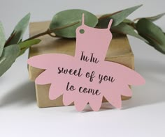 a pink butterfly shaped gift tag that says, put the sweet of you to come