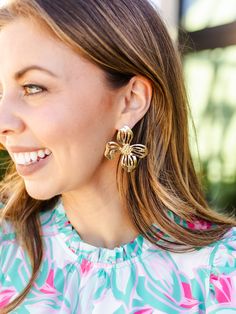 Blossom into spring with our timeless Alani Earrings. Featuring an organic shaped flower stud, these earrings introduce a delicate touch of floral sophistication to your everyday outfit. Organic shaped flower stud earrings 2.25" Brass plated Hypoallergenic Surgical steel posts Nickel and lead-free Feminine Drop Earrings For Spring, Gold Flower Earrings For Spring, Feminine Jewelry With Matching Earrings For Spring, Chic Spring Jewelry With Flower Charm, Elegant Spring Petal Shaped Flower Earrings, Flower-shaped Jewelry With Matching Earrings For Spring, Spring Flower Earrings For Pierced Ears, Chic Petal-shaped Earrings For Gift, Chic Spring Flower Earrings For Pierced Ears