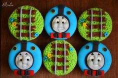 thomas the train cupcakes are decorated with fondant