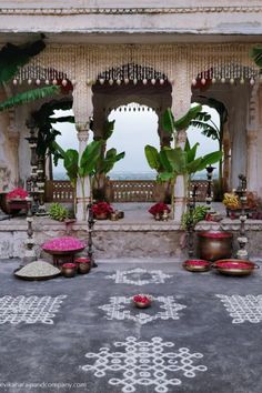 an outdoor area with potted plants and decorations