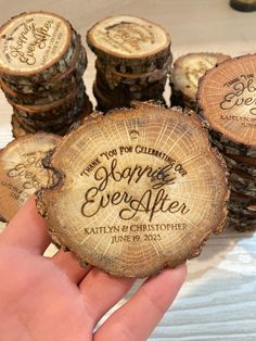 someone is holding up some wood slices with the words hope and ever after on them