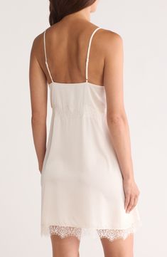 Feel your most glamorous through your morning and nighttime routines in this satin chemise trimmed in delicate lace. 25" center front (size medium) V-neck Adjustable straps 100% polyester Machine wash, dry flat Imported Elegant Chemise With Built-in Bra And Spaghetti Straps, Sheer V-neck Chemise For Wedding Night, Lace Slip Dress With Built-in Bra For Daywear, Sheer V-neck Slip Dress For Wedding Night, Elegant V-neck Chemise With Built-in Bra, Wedding Night Chemise With Built-in Bra And Spaghetti Straps, Lace Slip Dress With Delicate Straps For Daywear, Spring Delicate Lace V-neck Slip Dress, Summer Cami Slip Dress With Delicate Lace