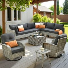 an outdoor living area with wicker furniture