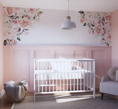 a baby's room with pink walls and floral wallpaper, a white crib in the foreground