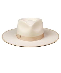 Inspired by vintage men’s styles, this hat is designed to make a statement. A stiffened wool fedora with rigid crown design. Trimmed on hat and rim with tonal gross grain ribbon. Ivory Rancher fedora hatTrimmed with tonal gross grain edged hat rim and bow ribbon detail 100% soft Australian wool Spot / specialist clean Brim measures 10 cm / 3.95” Classic crown height Rigid crown design Unisex style This hat is accredited with a UPF Rating 50+ (Australian Tested) Size + Fit: Rancher sizing runs sl Melbourne Cup Fashion, Crown Heights, Wool Fedora, Bow Ribbon, Crown Design, Unisex Style, Unisex Fashion, Fedora, Vintage Men