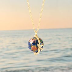 Fuel your wanderlust! Our world travel pendant necklace features an airplane that can rotate around the detailed globe – so you can dream of where you’ll visit next every time you wear it ✈ 🌎 Item #: 946904 Gold Medallion Jewelry For Travel, Gold Necklace With Round Pendant For Travel, Yellow Gold Pendant Necklaces For Travel, Luxury Travel Pendant Jewelry, World Map Necklace, Travel Necklace, Travel Globe, Detailed Necklace, North And South America