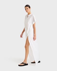 The Leiden Maxi Dress in White is a short sleeve linen dress crafted from a lightweight organic linen. This versatile dress features a stand collar, button placket at centre front and statement splits from the hem to underarm with optional button closure. The ultimate easy summer day dress with a stylish edge. Can also be worn open at the sides as a cover-up over your favourite swimsuit.100% Organic Linen sustainably milled in Portugal. Summer Day Dresses, Linen Maxi Dress, Caftan Dress, Dress Crafts, Organic Linens, Versatile Dresses, Easy Summer, White Maxi Dresses, Linen Dress