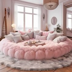 a living room filled with lots of pink furniture