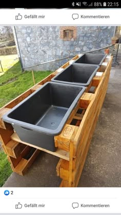 a wooden table with two sinks on it