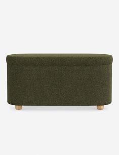 an olive green ottoman with wooden legs