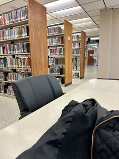 there are many bookshelves in the library and one has a jacket on it