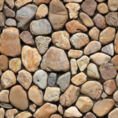 a stone wall with many different rocks on it