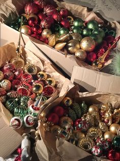 two boxes filled with assorted christmas ornaments