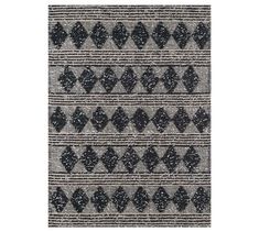 an area rug with black and white designs