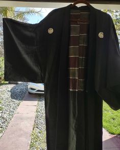 Vintage long black with striped lining kimono robe. Reversible and gender neutral. Know tags. It seems to be a fine quality silk robe. It fit me a little snug and I usually wear a size XL so I would say it's a large. Measurements will be be provided on request. I was told that the white emblems are a family crest of sorts. In excellent condition. Cheech And Chong, Carole King, Silk Robe, Family Crest, Led Zeppelin, Long Black, Black Silk, A Family, The White