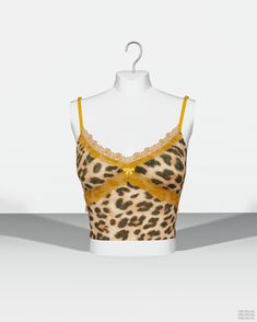 a mannequin wearing a leopard print bra with yellow trimmings and an underwire