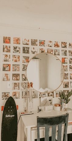 a white desk with a mirror on top of it next to a black surfboard