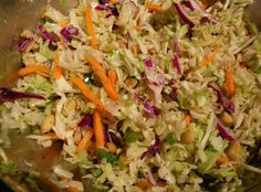 a bowl filled with coleslaw and carrots