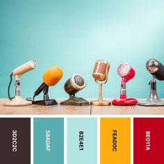 five microphones are lined up in a row with the colors red, yellow, blue, and green