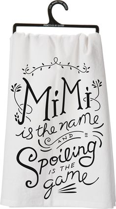 a towel hanging on a rack with the words,'mim is the name and spelling