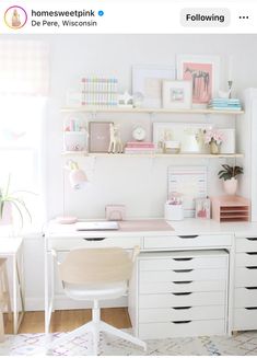 a white desk topped with lots of drawers next to a shelf filled with books and pictures