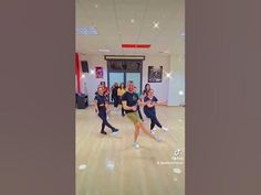 group of young people dancing in a dance studio