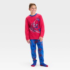 Get your superhero ready for bed by dressing them in the Spider-Man 2-Piece Cozy Pajama Set and Socks. This red pajama set includes a red long-sleeve sleep shirt and a pair of pajama pants, both with a Spider-Man print, as well as matching red and blue socks for a cozy look. Made from soft fabric, the pieces are comfortable and warm to wear. Winter Character Print Loungewear Sleepwear, Winter Sleepwear With Character Print, Winter Loungewear Sleepwear With Character Print, Playful Red Sleepwear For Sleepover, Playful Red Sleepwear For Sleepovers, Red Character Print Sleepwear For Sleepover, Red Character Print Loungewear Sets, Red Winter Sleepover Sets, Red Pajamas