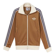 This Men's adidas originals Brand Logo Printing Zipper Classic Sports Jacket is the perfect addition to your wardrobe. It's designed to keep you comfortable and stylish during any activity. The classic silhouette and bold branding make it stand out from the crowd. The jacket is made with a lightweight fabric that is breathable and comfortable. The zipper closure ensures a secure fit and the adjustable drawstring waistband allows you to customize your look. The jacket is part of the adidas originals series, inspired by classic sportswear and streetwear. It's the perfect jacket for any occasion and is sure to make a statement. (Stripe) Adidas Sporty Track Jacket With Logo, Sporty Adidas Track Jacket, Adidas Athleisure Track Jacket With Side Stripes, Adidas Sporty Streetwear Track Jacket, Functional Track Jacket With Three Stripes For Sports Season, Sporty Outerwear With Zipper Closure, Sportswear Track Jacket With Zipper Closure, Sporty Brown Track Jacket With Long Sleeves, Brown Sporty Track Jacket For Winter