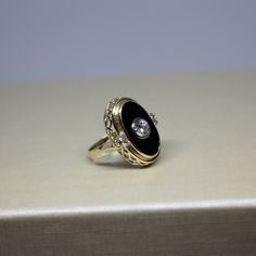 Formal Oval Black Enamel Ring, Formal Black Enamel Oval Ring, Formal Oval Enamel Ring With Black Enamel, Formal Oval 14k Gold Enamel Ring, Oval 14k Gold Enamel Ring For Formal Occasions, Formal Yellow Gold Diamond Ring With Black Enamel, Formal Oval Enamel Ring In 14k Gold, 14k Gold Oval Enamel Ring For Formal Occasions, Formal Black Enamel Ring