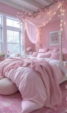 a bedroom decorated in pink and white with lots of lights on the windows sill