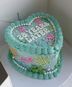 a heart shaped cake with the words be brave on it's frosting and decorations