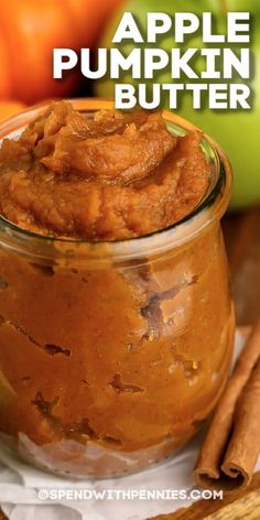 an apple pumpkin butter in a glass jar with cinnamon sticks