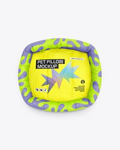 a yellow and purple pet pillow with stars on it's sides, sitting in front of a white background