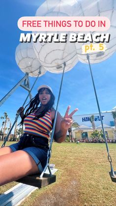 a woman sitting on top of a swing with the words free things to do in myrtle beach