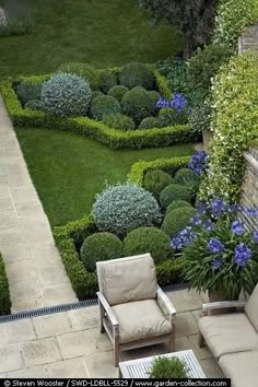 an outdoor garden with lawn furniture and flowers