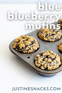 blueberry muffins in a muffin pan with text overlay that reads, blueberry muffins