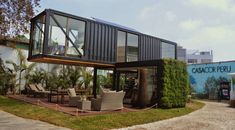 a house made out of shipping containers is featured in this image with the words solumec above it