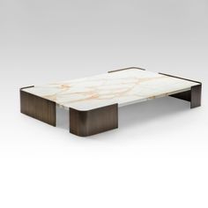 a coffee table with marble top and wooden legs, on a white background in the style of art deco