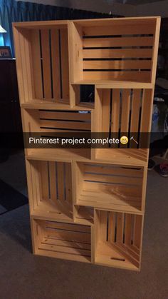 a wooden shelf with several compartments on it