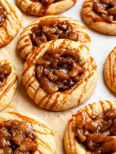 some cookies with caramel and pecans on top