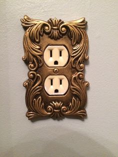 an ornately decorated switch plate covers the wall