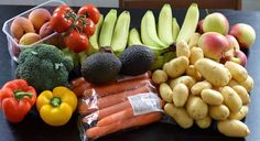 an assortment of fruits and vegetables on a table