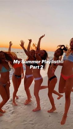 several women in bikinis are dancing on the beach