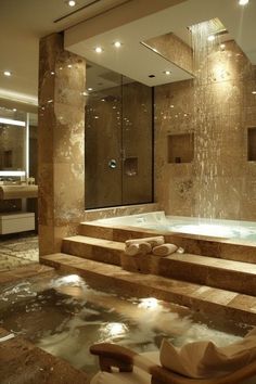 a bathroom with a large jacuzzi tub next to a walk in shower