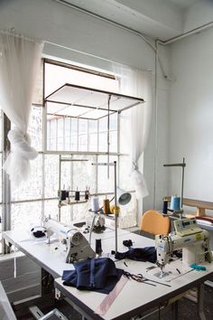 a sewing machine sitting on top of a white table