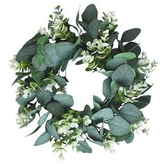 a wreath with white flowers and green leaves