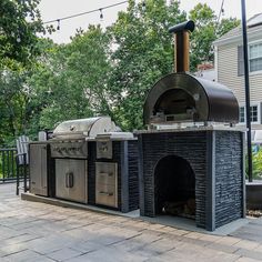 an outdoor bbq grill with two ovens on it