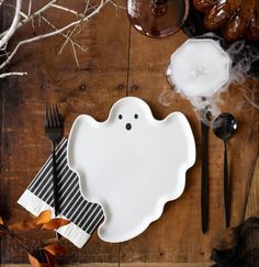 a ghost shaped plate on top of a wooden table